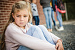 © Louis-Photo - sad intimidation moment Elementary Age Bullying in Schoolyard
