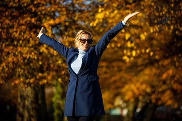 Wall Mural - middle-aged woman walking in city park