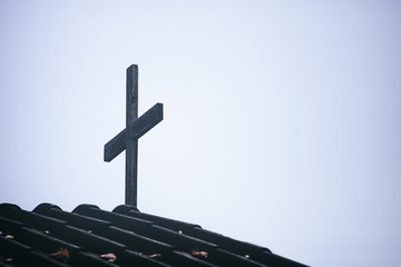 Wall Mural - Christian cross standing on church. christian concept.