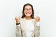© Asier - Young european business woman celebrating a victory or success