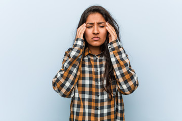 Wall Mural - Young cool indian woman touching temples and having headache.