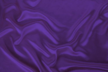 soft folds on bright purple shiny silk, luxury concept, background for the designer, horizontal, close-up, copy space