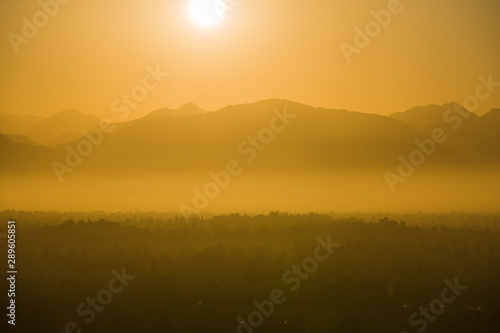 Hot smoggy summer sun risin...