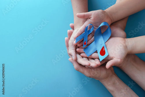 Fotografía Light blue ribbons with blood on blue background , world diabetes day
