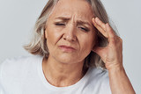 Fototapeta Zwierzęta - senior woman with headache