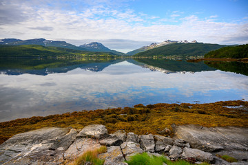 Sticker - Mountain and sky views reflected in the water at lofoten islands, Norway