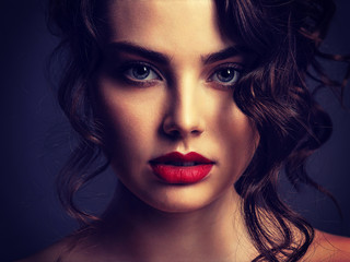 Poster - Face of a beautiful woman with a smoky eye makeup and red lipstick