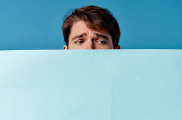 Wall Mural - young man holding a board