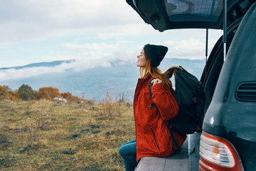 man sitting on top of mountain