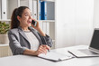© kegfire - Excited office worker speaking on phone