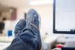 © FotoAndalucia - clerk worker resting at desk with foot on table