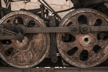 Closeup View Of Old Rusty Weather Wheels Of Train Standing Outdoor. Horizontal Color Photography.