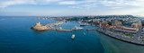 Fototapeta  - Aeria view of Rhodes city, Dodecanese, Greece. Panorama with Mandraki port, lagoon and clear blue water. Famous tourist destination in Europe