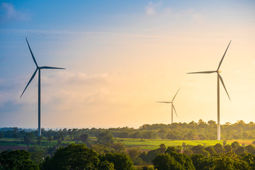 Wall Mural - Green energy concept, eco power. Wind turbine located along the hill with the wind blowing all the time. Can produce renewable energy as well. Considered a clean energy.