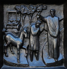 The Baptism of the Eunuch, relief on the door of the Grossmunster (