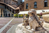 Fototapeta  - Piazza Vecchia in Citta Alta or Upper Town in Bergamo, Italy. Lion statues with chains at the vintage fountain.