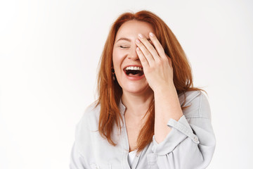 Wall Mural - Happiness, aging, beauty concept. Carefree good-looking redhead middle-aged woman laughing cheerful touch face close eyes giggle emotive have fun family circle enjoy retirement, white background