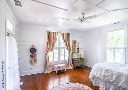 Girl S Bedroom With Striped Curtains Rug And White Ruffles