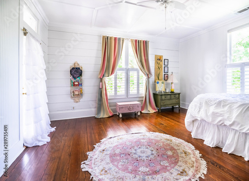 Bedroom With Shiplap Walls Rug Ruffles Pastels Wood