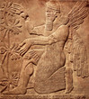 Assyrian relief of god, art of Middle East, Babylonian and Sumerian civilization history