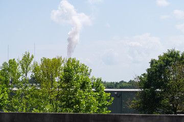 Factory or production plant facility smoke from chimney pipe in Mobile, Alabama