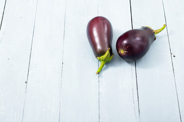 eggplants on shabby chic bright wood table