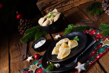 Wall Mural - Polish Christmas pierogi with sauerkraut and mushrooms