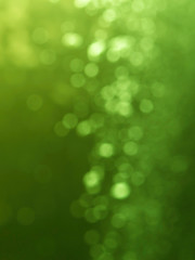 Wall Mural - abstract green bokeh defocus glitter blur background.