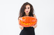 © satura_ - Halloween and masquerade concept - Beautiful young woman posing with Pumpkin Jack-o'-lantern