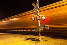Train Passes A Crailway Crossing By Night At Route 66