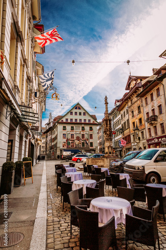 Old town street and restarurant tables in Lucerne city, Switzerland Tableau sur Toile