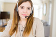 © Krakenimages.com - Beautiful young operator woman wearing headset at the office Relaxed with serious expression on face. Simple and natural with crossed arms