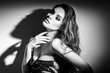 © Subbotina Anna - Sexy Young Woman black and white portrait. Seductive young woman in lingerie in darkness. Glamour lady with long hair posing in spotlight. Gorgeous seductive model girl with long hair b&w