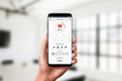 © Stanisic Vladimir - Measuring heart rate app on smart phone in hand. Concept of measuring in office. Modern, flat design app concept.