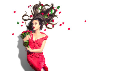 Poster - Beauty Sexy Model girl lying on white background with red rose flowers in her hair and a bunch. Beautiful young woman with long hair and perfect make-up, red seductive lips, smoky eyes. Birthday Gift 