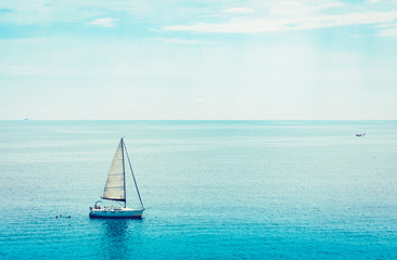  Sea view with sailboat, motor boat from Taormina, Sicily, Italy.
