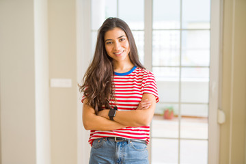 Sticker - Young beautiful woman wearing casual t-shirt happy face smiling with crossed arms looking at the camera. Positive person.