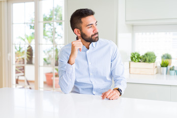 Sticker - Handsome hispanic business man looking to side, relax profile pose with natural face with confident smile.