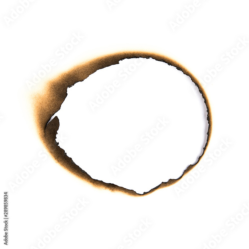 Cuadros en Lienzo Burn hole old brown paper on white texture background