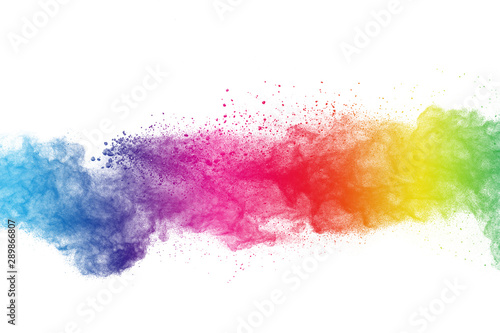 Colorful powder explosion on white background. Abstract pastel color dust par...