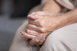 © fizkes - Close up unhappy lonely mature woman folded hands together