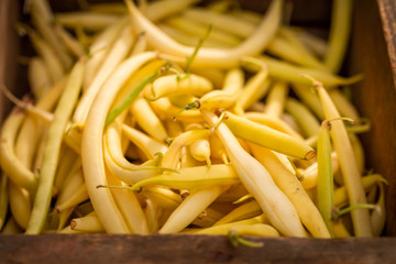 Wall Mural - Harvested yellow beans in a old wooden box