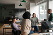 © mavoimages - Diverse designers discussing a project together in their office