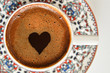 cup of coffee with heart on red background