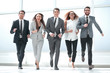 © ASDF - in full growth.a group of business people walking together.