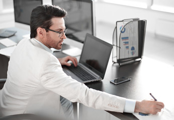 Wall Mural - businessman writing down information in a notebook