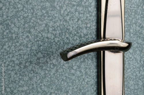Fotomural Chrome door lock on blue iron door