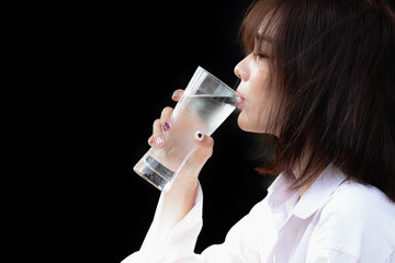 Asia woman drinking water with happy.