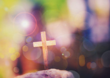 Close Up Of Wooden Cross On The Rock Over Blurred Colorful  Bokeh  Light With Word From Bible Verses, John 3:16 , Christian Background With Copy Space.