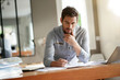 © goodluz - Modern man working in office